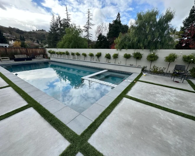 outdoor pool with concrete walkway